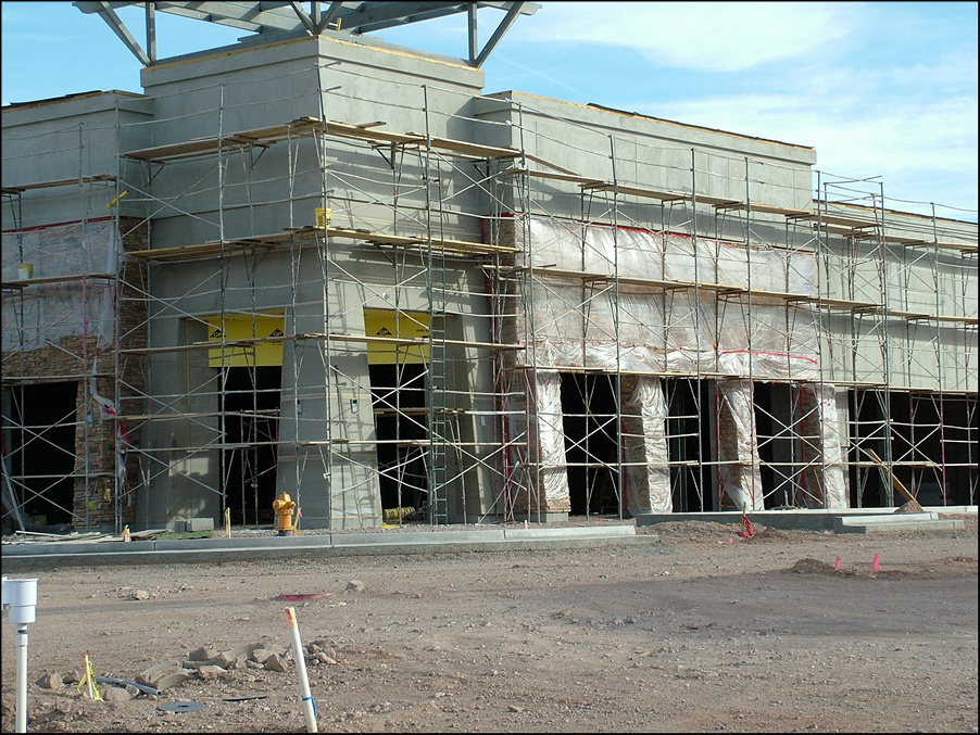 Mall - strip center encased in scaffold